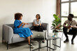© Valentina Barreto/Stocksy - Cool mixed businesspeople in rest office area
