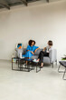 © Valentina Barreto/Stocksy - Business women talking in office rest area