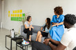 © Valentina Barreto/Stocksy - Coworkers resting at office