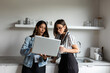 © Valentina Barreto/Stocksy - Businesswomen watching laptop during break