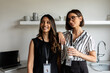 © Valentina Barreto/Stocksy - Businesswomen in office kitchen portrait