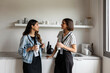 © Valentina Barreto/Stocksy - Female co-workers during break in office kitchen