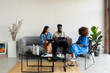 © Valentina Barreto/Stocksy - Business group casual meeting on couch