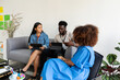 © Valentina Barreto/Stocksy - Diverse casual creative team meeting on sofa