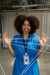 © Valentina Barreto/Stocksy - Afro haired businesswoman with intertwined threads