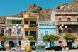 © Jimena Roquero/Stocksy - Colorful houses in a street of Sicily
