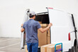 © ALTO IMAGES/Stocksy - Delivery man closing van trunk