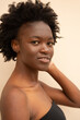 © ohlamour studio/Stocksy - Young woman looking at camera portrait