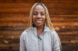 © Lupe Rodríguez/Stocksy - portrait of young black woman with blonde braids and sportswear