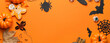 Leinwandbild Motiv Composition with tasty Halloween treats on orange background with space for text
