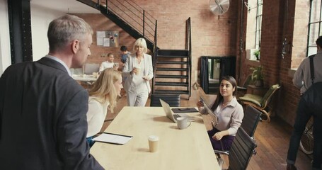 Aufkleber - Meeting with a group or team of corporate business people, colleagues and coworkers in a modern office to discuss, plan and talk strategy. Arriving for a presentation, workshop or training seminar