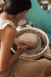 © Brkati Krokodil/Stocksy - Woman Making A Bowl On The Pottery Wheel