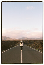 Girl Walking At Road Landscape In Lanzarote