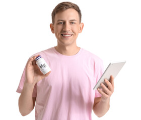 Wall Mural - Young man with bottle of magnesium on white background