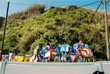 © Olga Moreira/Stocksy - Traffic signs behind a fence