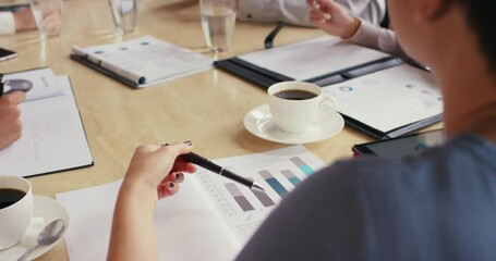 Aufkleber - Closeup of a young woman reading finance data in a business meeting with colleagues, discussing plans and strategies. Team making budget cuts, looking at statistics, graphs and reports