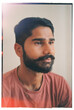 © Tessy Morelli/Stocksy - Film portrait of Indian young man meditative