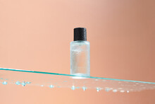 Bottom View Of One Bottle Of Toner Stands On A Glass Table