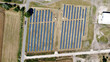 © Balazs Kovacs/Stocksy - Aerial view of solar power farm