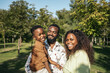 © Pedro Merino/Stocksy - Portrait of a happy black family in the countryside