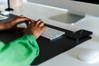 © David Prado/Stocksy - Female working on computer in home office