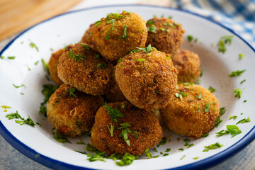 Vegan broccoli croquettes with goat cheese.