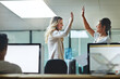 © Daniel L/peopleimages.com - High five, teamwork and winning are important to a successful professional collaboration at work together. Happy and excited businesswoman celebrates a job promotion with a coworker at the office