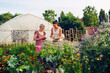 © zorandim75 - Mother and daughter enjoying gardening in home backyard