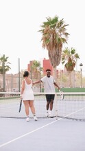 Couple Cheering Up Each Other After The Tennis Game