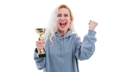 A young woman rejoices at winning the competition. Model with the cup of the winner of the competition on a white background