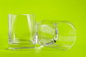 Glasses on green background