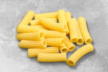 Wall Mural - Penne pasta. Raw italian pasta on background,