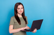 Leinwandbild Motiv Photo of boss millennial brunette lady hold laptop wear striped t-shirt isolated on blue color background