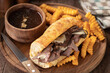 French dip sandwich and bowl of au jus