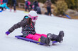 © FiledIMAGE - Young Girl Tobogganing in Australia