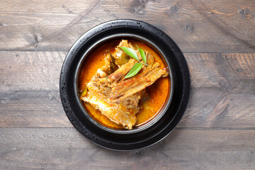 Wall Mural - Kari or Gulai Iga Kambing or is Indonesia Traditional mutton ribs curry soup. is a type of food containing rich and spicy.