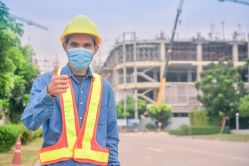 Wall Mural - Asian Engineer standing outdoor on site construction posting confident , Engineer construction happy job success with in target planning