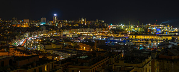 Sticker - Panoramic view of Genoa at night with the causeway and the buidings of the historic center, Italy