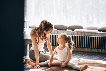 Wall Mural - Mother and daughter yoga at home