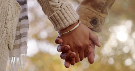 Sticker - Love, affection and loving couple holding hands while bonding and spending time together outdoors at a park. Closeup of man and woman out for a romantic walk and fresh air on a casual date in autumn