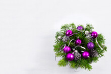 Christmas Wreath With Silver Ribbon And Purple Baubles, Copy Space.