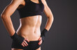 © lenets_tan - Athletic woman pumping up muscules with dumbbells