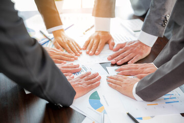 Wall Mural - Close-up of group hand success business people person working together in office. Diversity of businessman and businesswoman attending corporate meetings. concept of friendship, cooperation corporate.