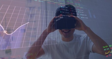 Poster - Animation of financial and stock market data processing over asian man wearing vr headset