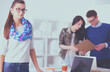 © lenets_tan - Young business people working at office on new project