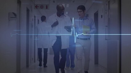 Sticker - Animation of heart rate monitor over two diverse male doctors discussing at hospital