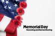 Memorial Day, Honoring and Remembering. American flag and red poppy flowers on white background, above view