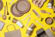 Leinwandbild Motiv Different eco items on yellow background, flat lay. Recycling concept