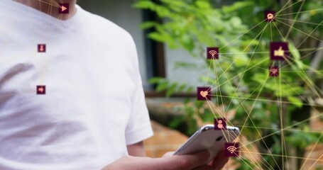 Poster - Animation of network of connections with icons over caucasian man using smartphone