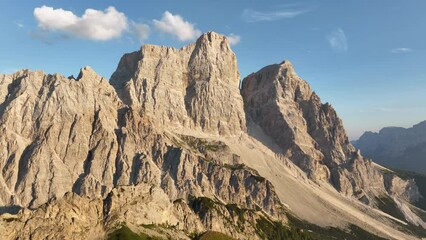 Wall Mural - View from above, stunning aerial view of a person enjoying the view of Monte Pelmo from the summit of Col de la Puina. Monte Pelmo, Dolomites, Italy.